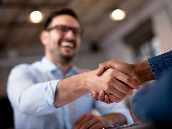 Business people shaking hands.